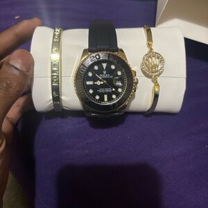 Rolex Black and Gold Timepiece with Accessories